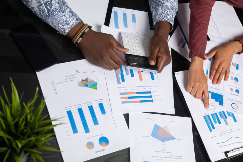 business outcomes to focus on for a successful agile transformation - workflow documentation on a table