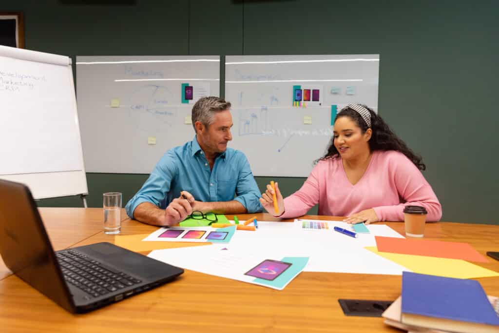 Two business people discussing Agile product delivery strategy