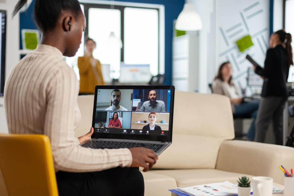 Impact of Remote and Hybrid Work on Agile Teams concept with video conference taking place