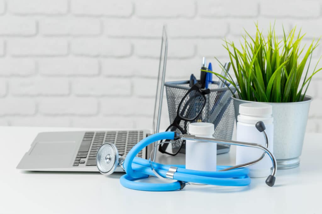 Stethoscope and laptop showcasing innovation in modern healthcare practices.