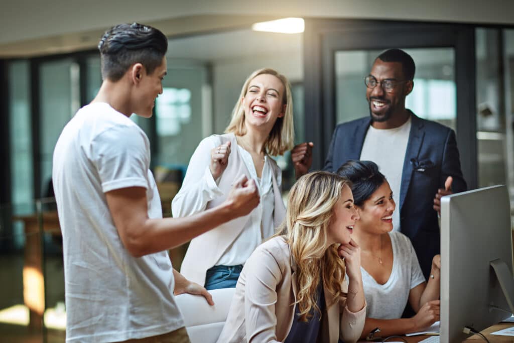 team morale concept with happy and smiling employees working in hybrid Agile environment
