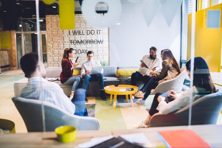 Group brainstorming in a modern workspace, fostering creativity and collaboration.