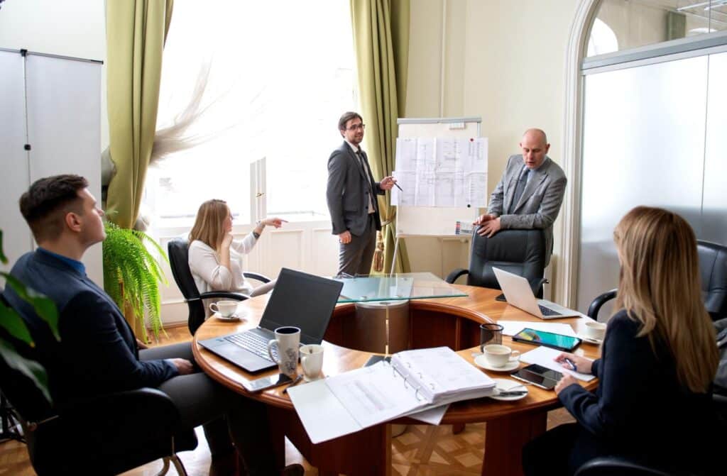 Team collaboration in a modern conference room during a strategic meeting.